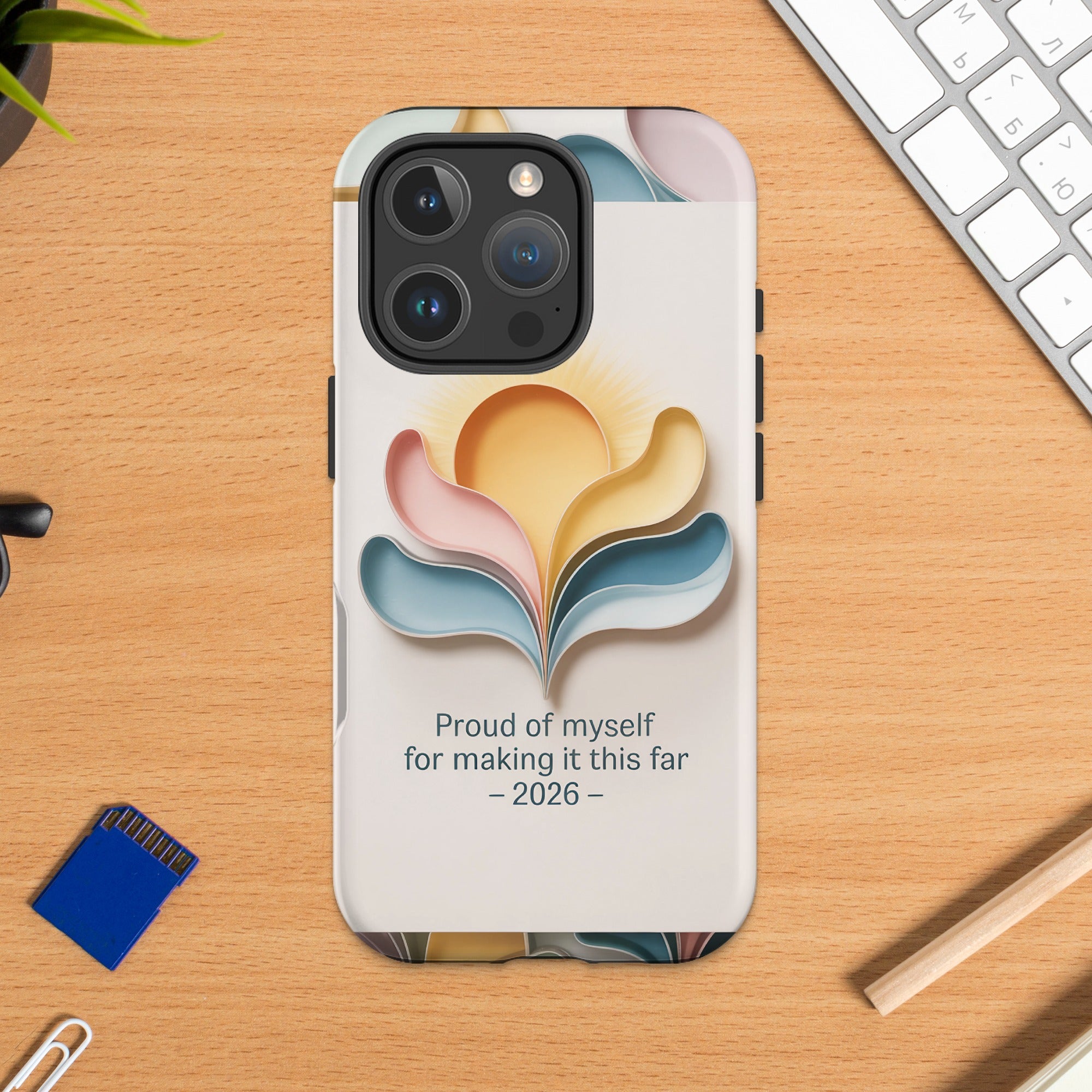 Phone case with abstract sun design and text "Proud of myself for making it this far - 2026".